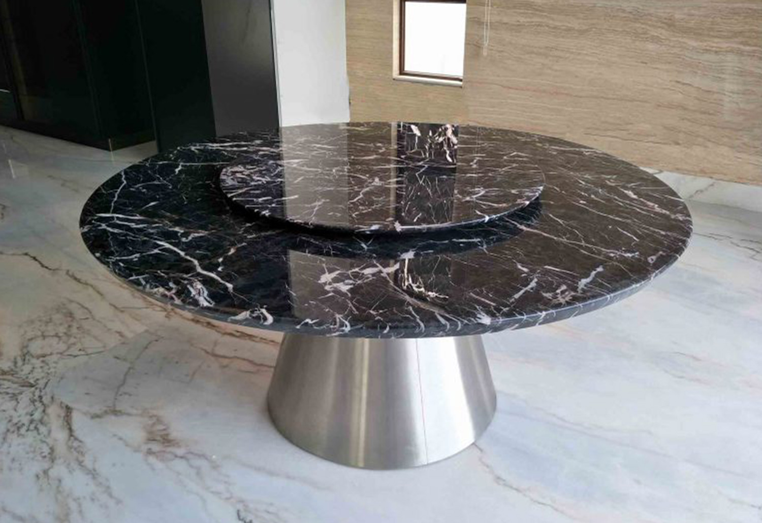 Dine in Style with this Round Black Marble Dining Table